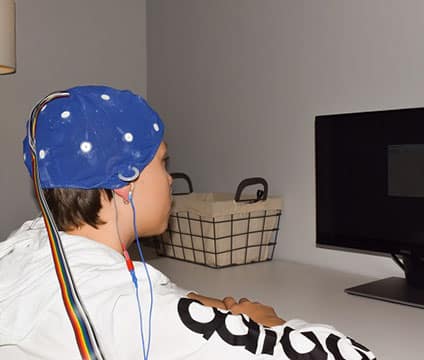 Girl receiving neurotherapy treatment