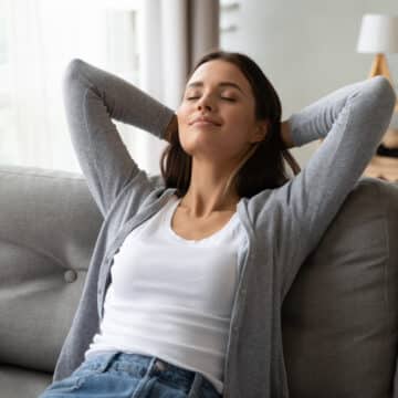 Young Woman resting on a comfortable sofa