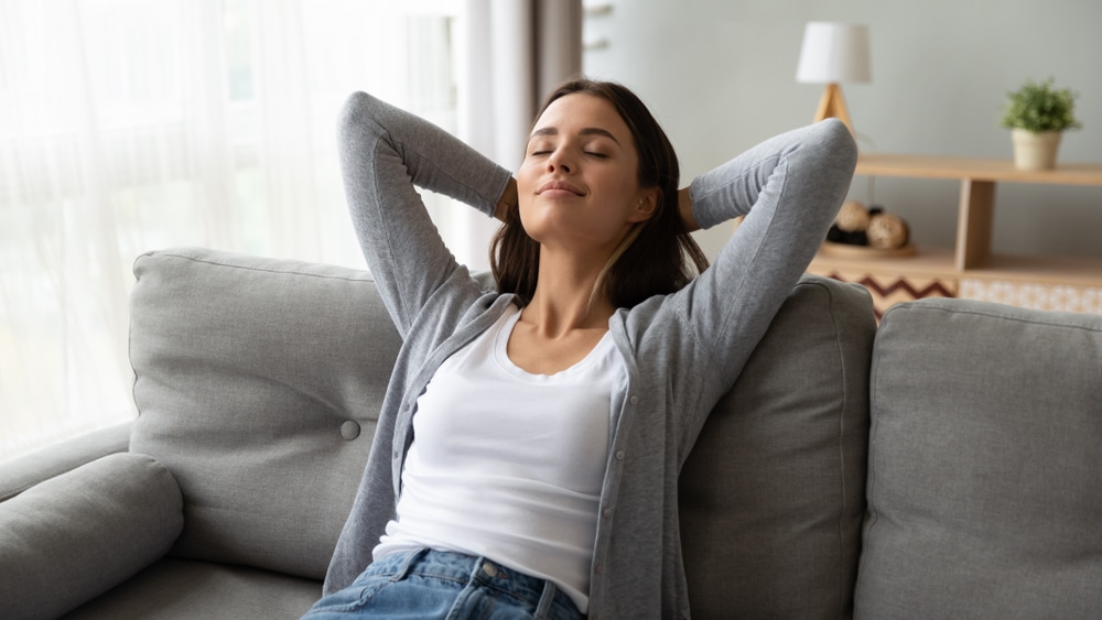 Young Woman resting on a comfortable sofa