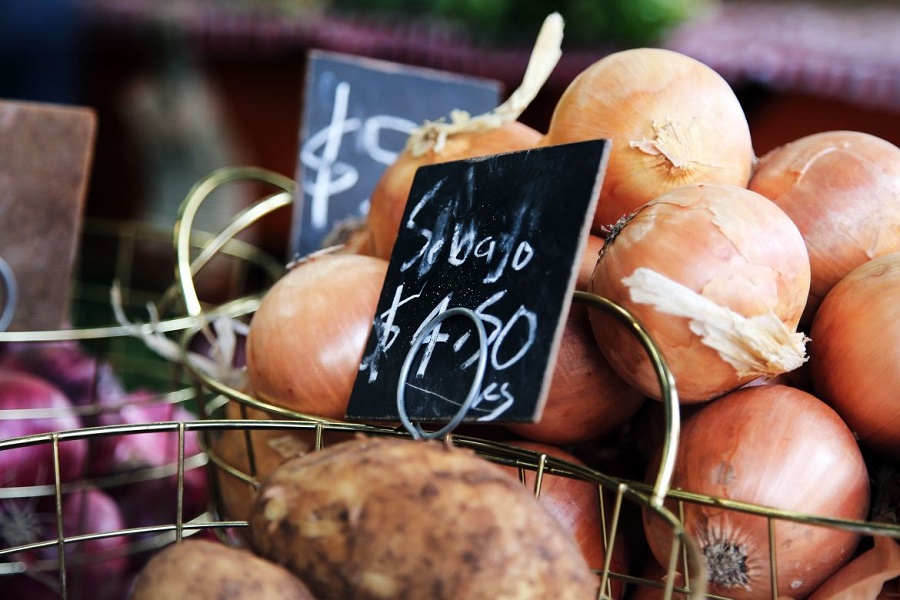 Onions in a basket for sale