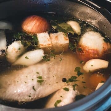 Chicken broth with onions, garlic and bay leaves