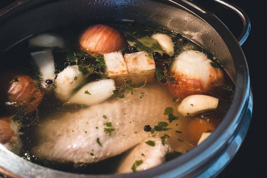 Chicken broth with onions, garlic and bay leaves