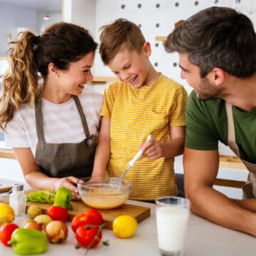 Family cooking and enjoying healthy nutritious food that benefits their mental health