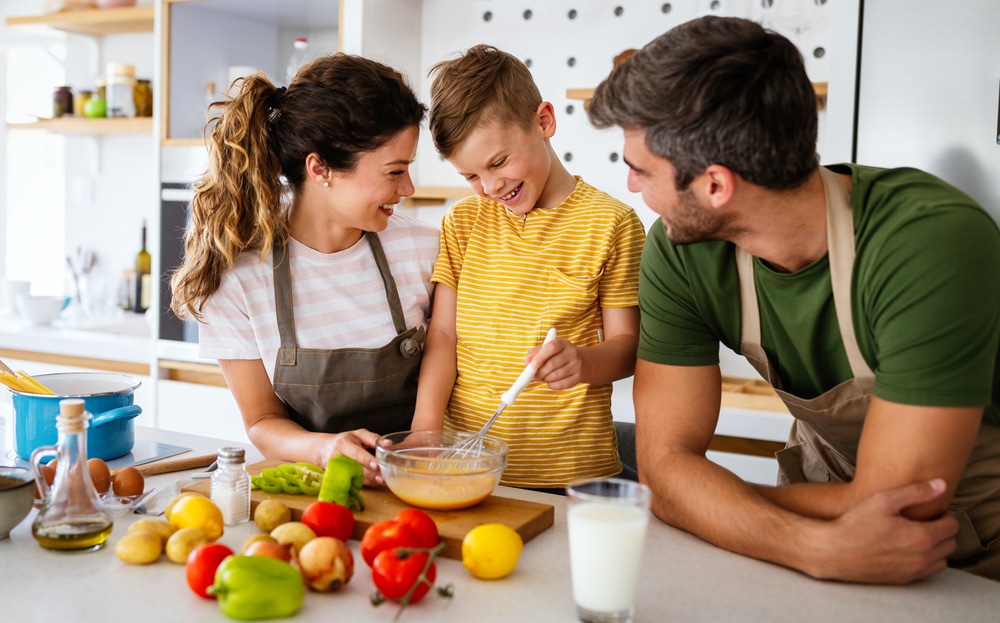 Family cooking and enjoying healthy nutritious food that benefits their mental health