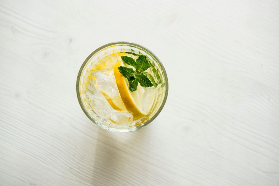 Glass of water with lemon and mint