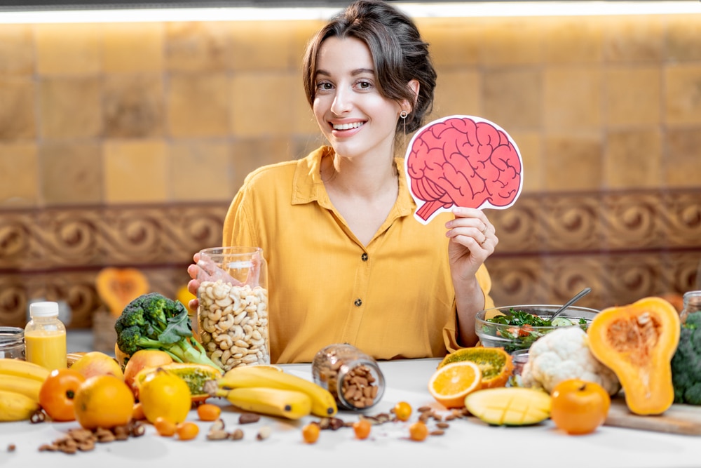 Woman eating food that is good for the brain